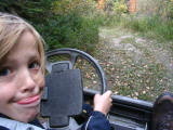 Sam driving golf cart